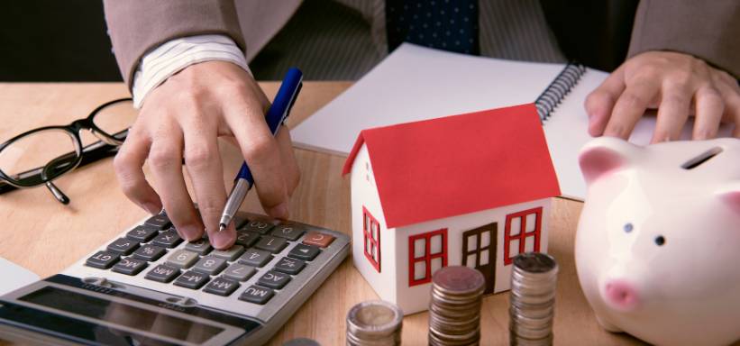 Homeowner comparing interest rates for home loan refinancing